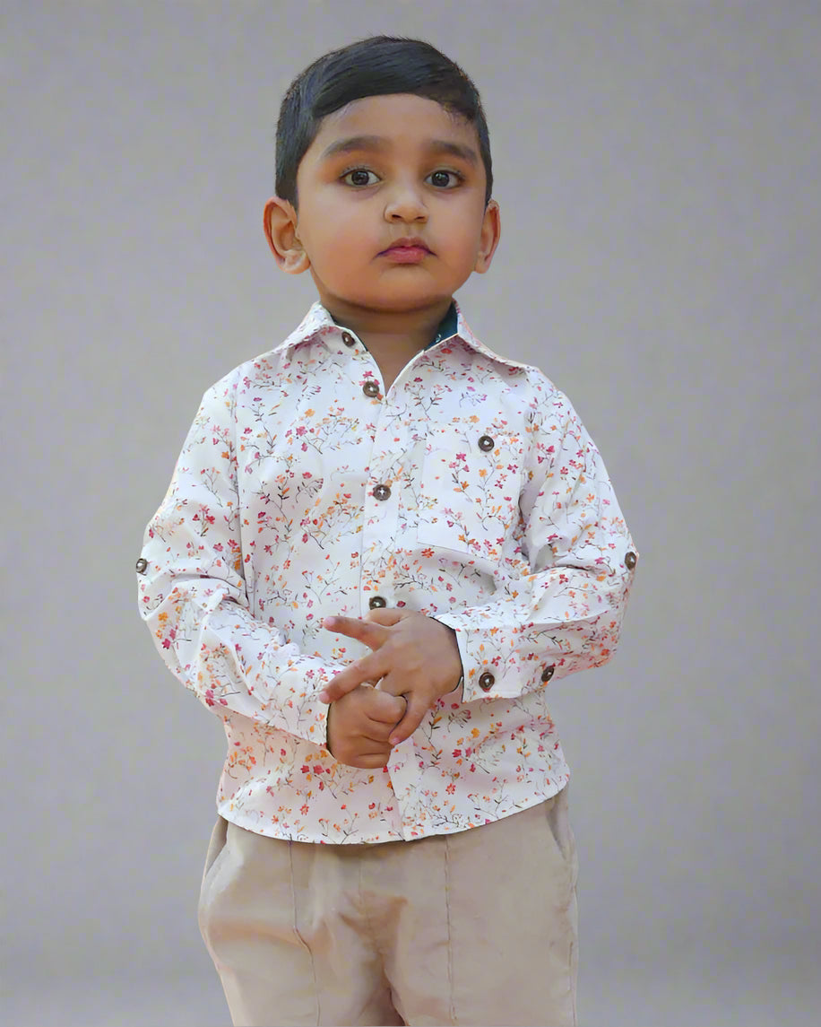 A boy wearing Floral Full Sleeve Shirt for Boys by Annies.