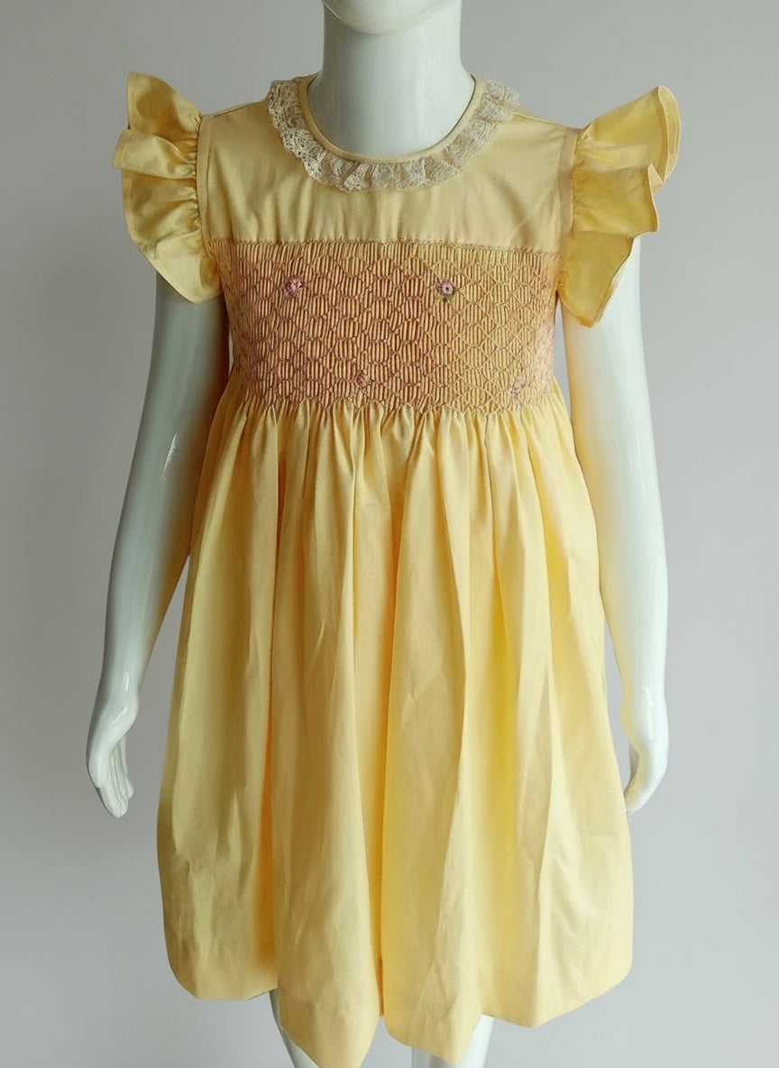 Hand_Smocked_Yellow_Dress_front View worn on mannequin by annies.co.in