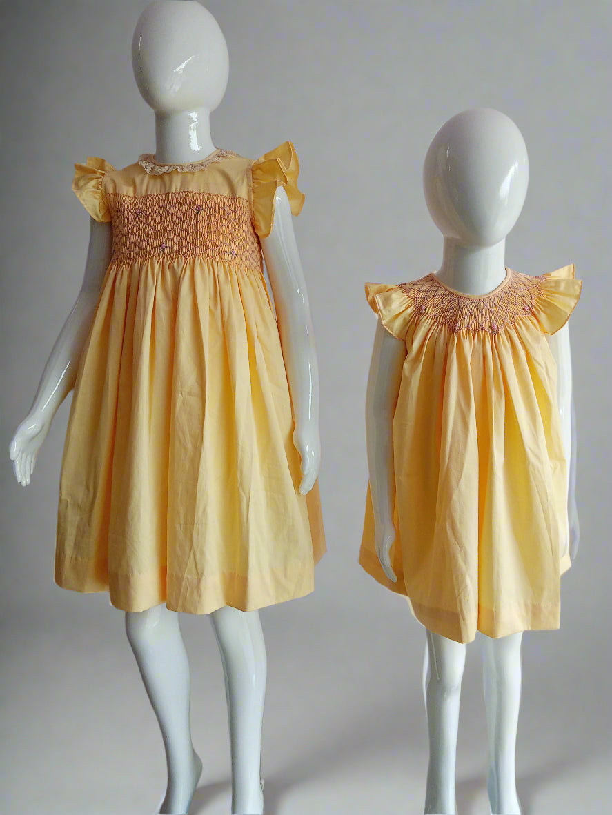 Handmade Yellow Smocked Bishop Dress for Babies by annies.co.in