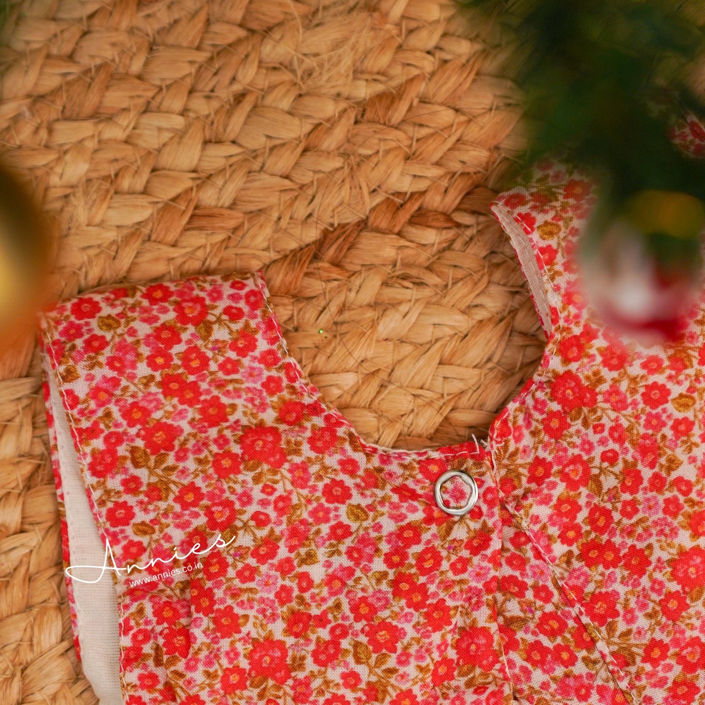 Floral dress with red flowers on a woven surface