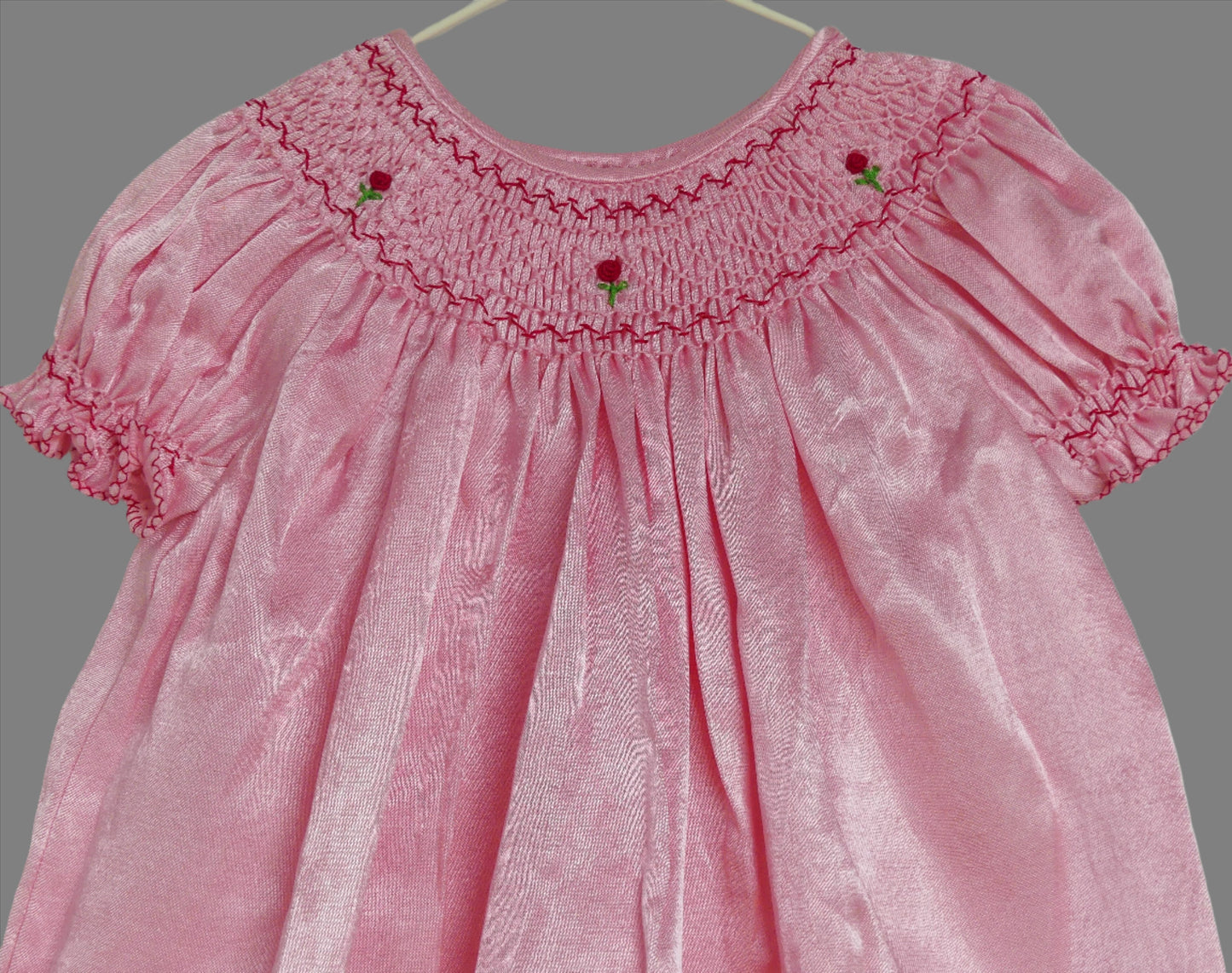 Round Neck Close Up of Rosie_smocked_bishop_dress by Annies