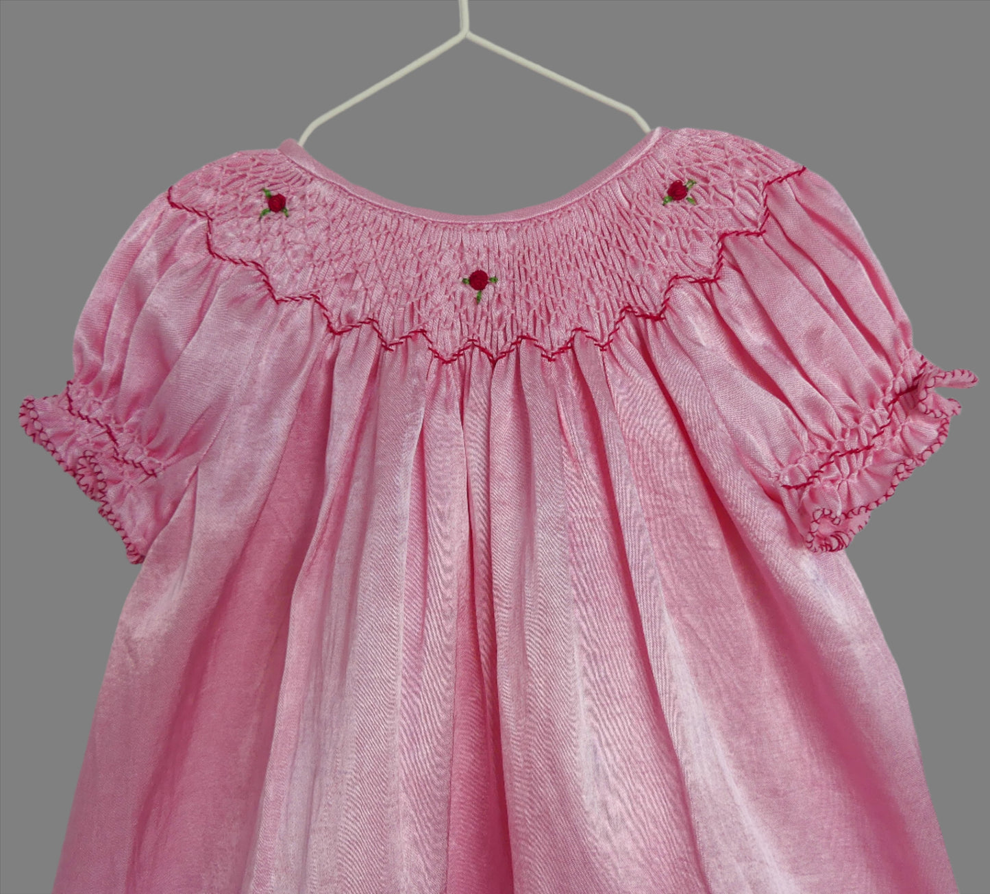 Front Close Up of rosie_smocked_bishop_dress by Annies