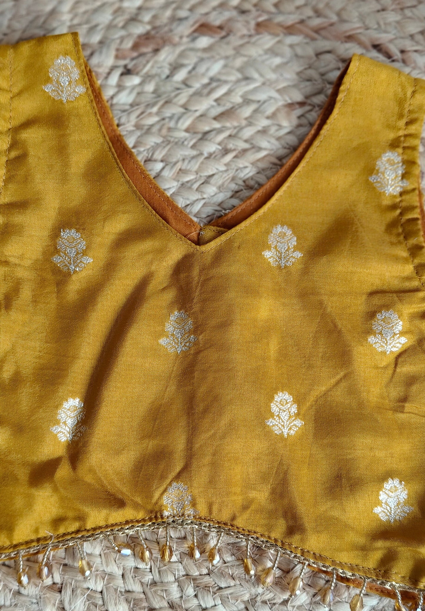 Swarna Dalam mustard yellow V-Neck sleeveless blouse