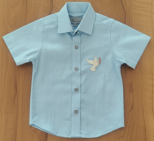 Light blue shirt with a bird design on table