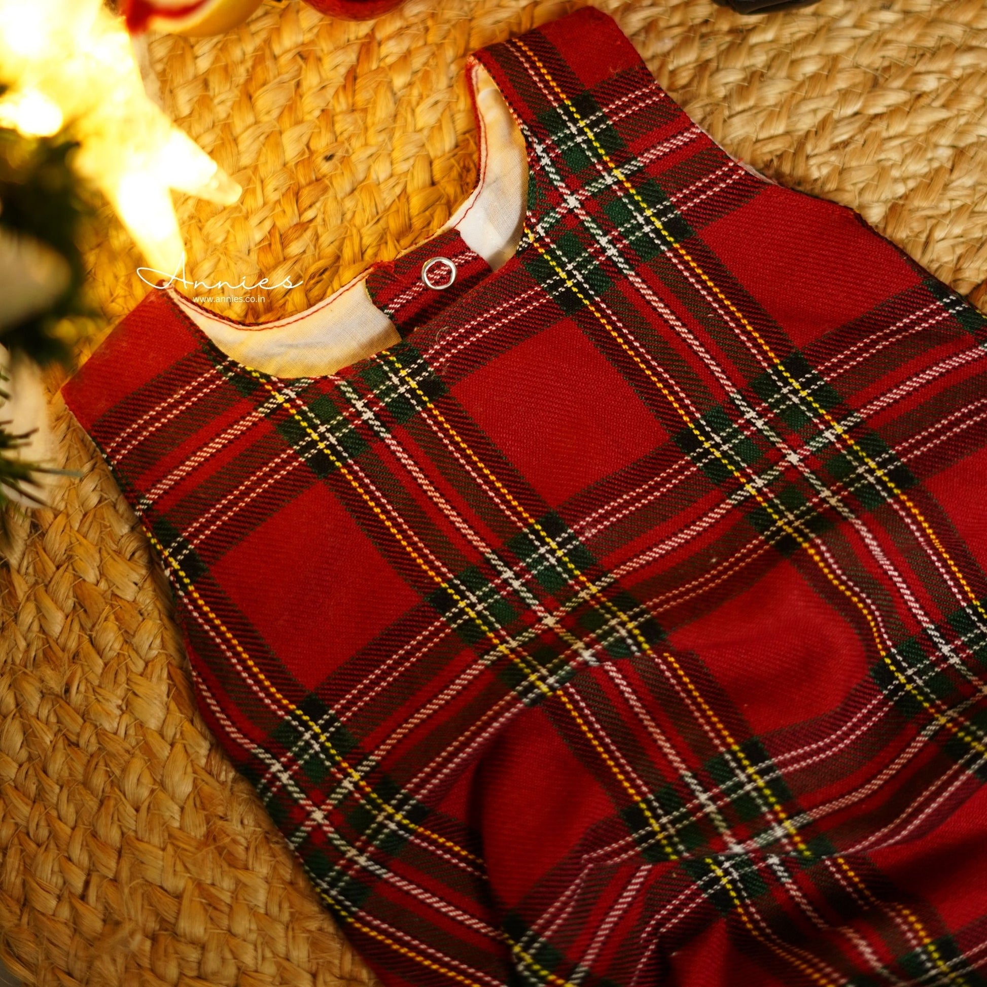 Red plaid fabric romper close up