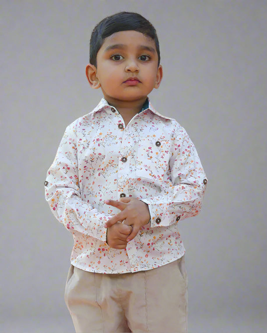 A boy wearing Floral Full Sleeve Shirt for Boys by Annies.