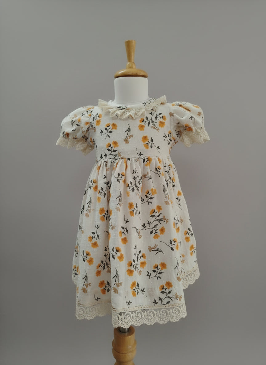 Floral dress on a mannequin against a white background