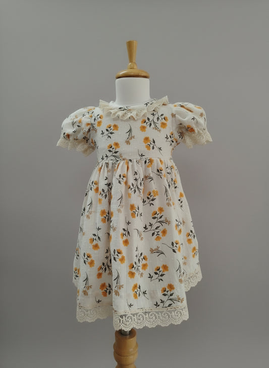 Floral dress on a mannequin against a white background