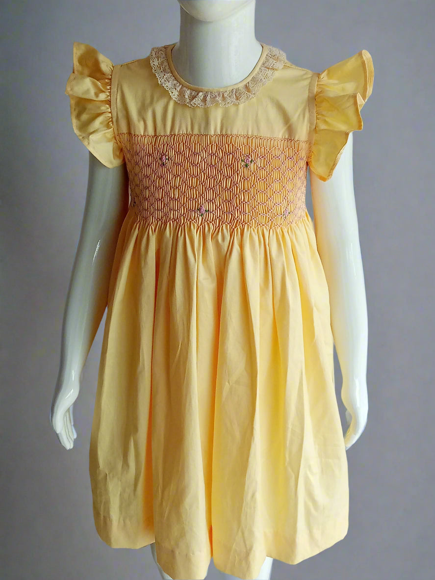 Hand_Smocked_Yellow_Dress_front View worn on mannequin by annies.co.in