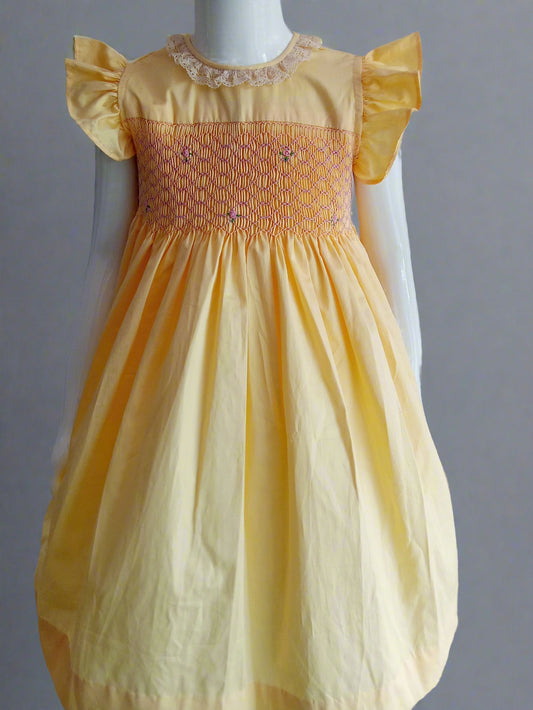 Hand_Smocked_Yellow_Dress_front View worn on mannequin by annies.co.in