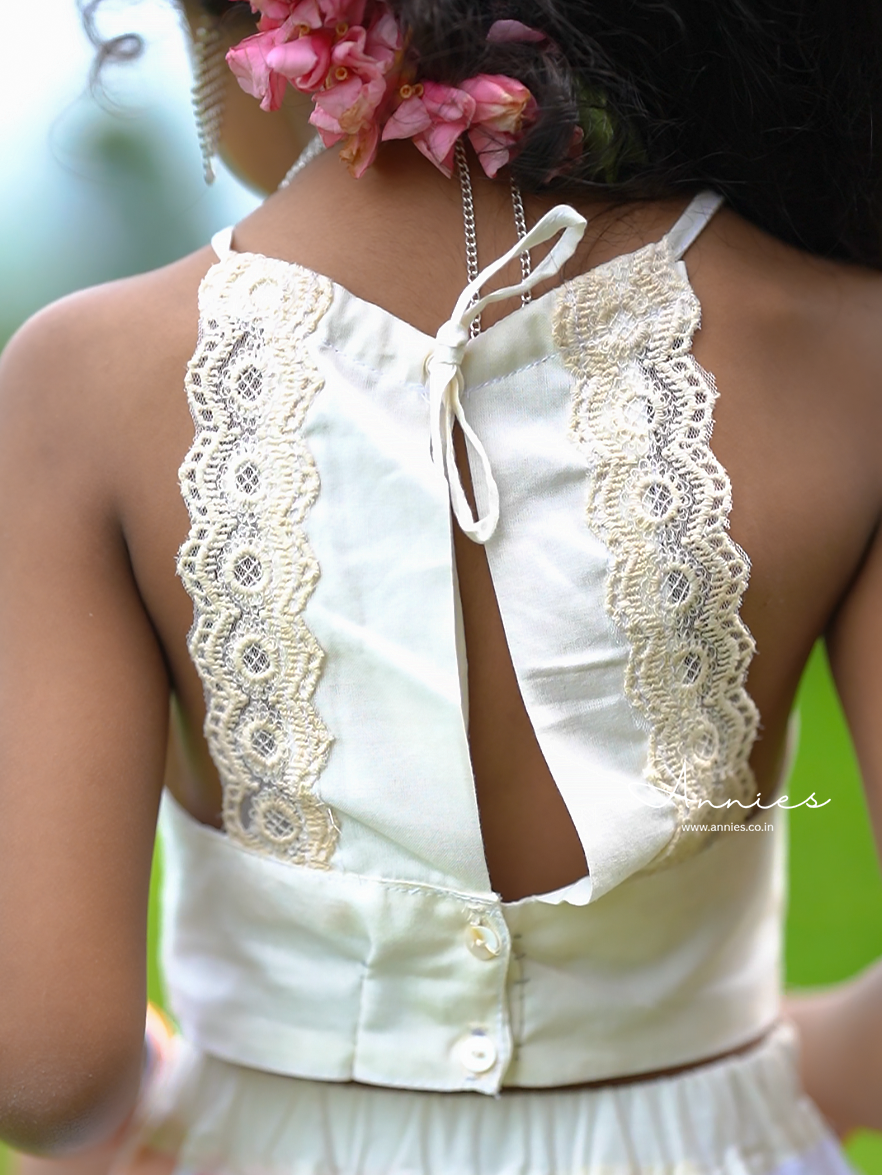 White lace-trimmed top worn by a girl by annies.co.in