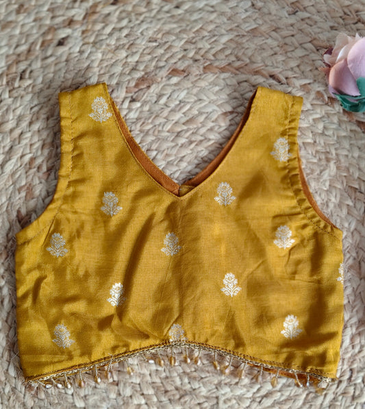 Swarna Dalam mustard yellow V-Neck sleeveless blouse